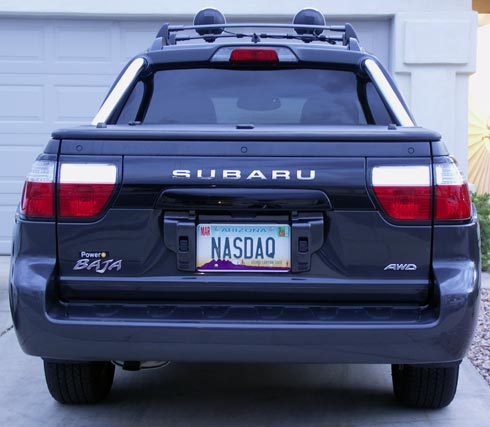 Subaru Baja with license plate reading NASDAQ
